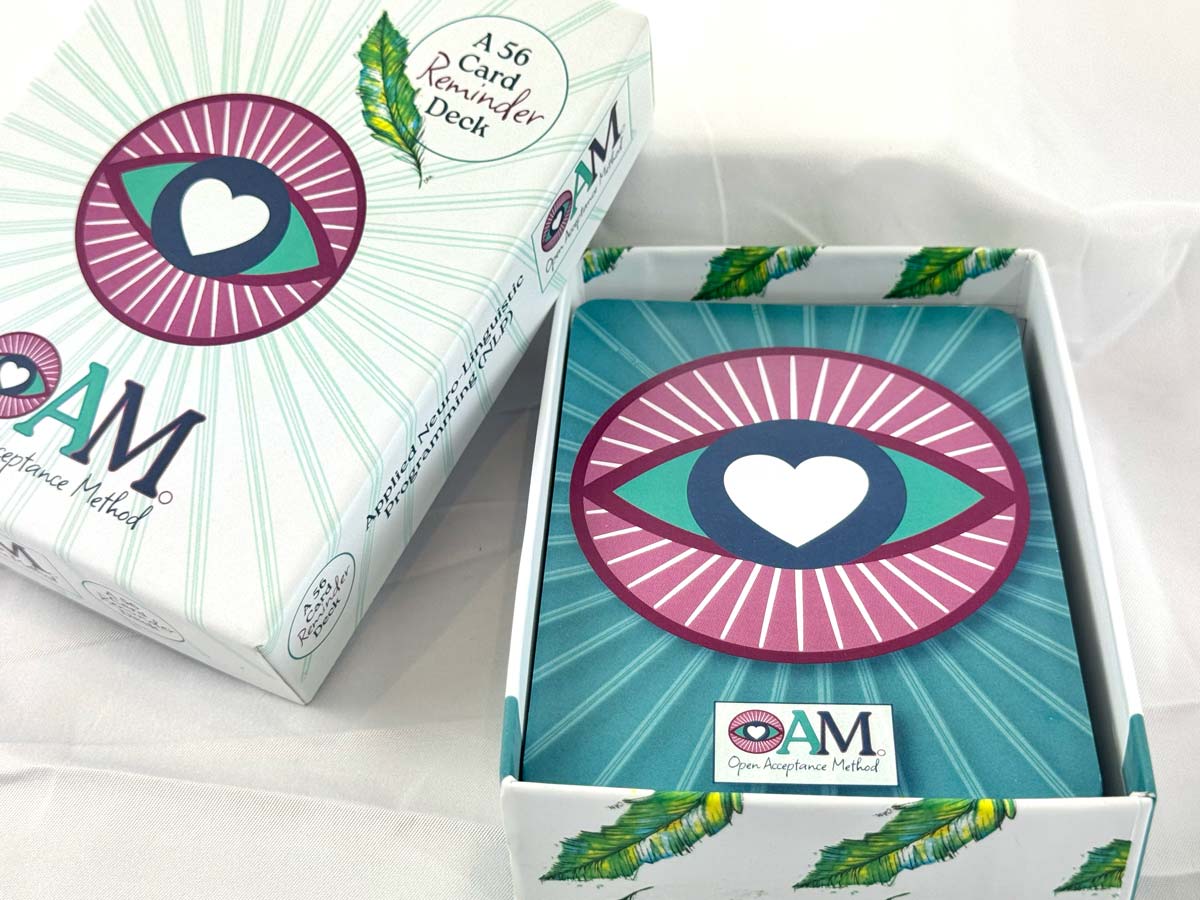 Hand-illustrated OAM Reminder Deck cards spread across a table.